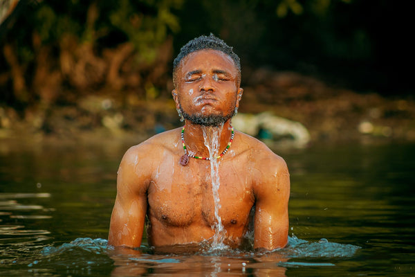 A man immersed in cold natural water