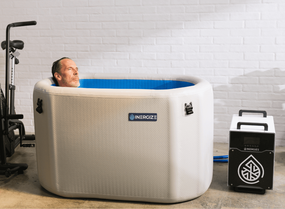 man-in-cold-plunge-tub-with-chiller-on-the-side